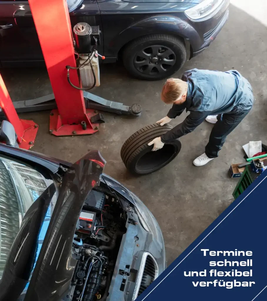 Mechaniker wechselt Reifen in Autowerkstatt Hittfeld nahe Seevetal mit Hebebühne